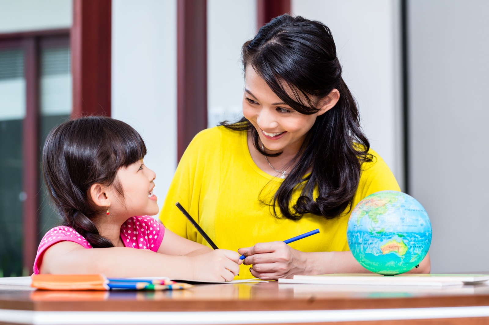 Parent and child working through a multisensory learning activity together